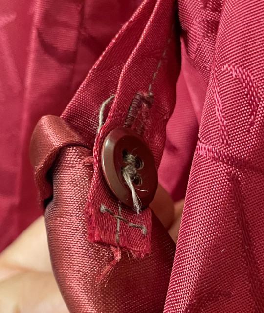 Security button on the right collar and lapel